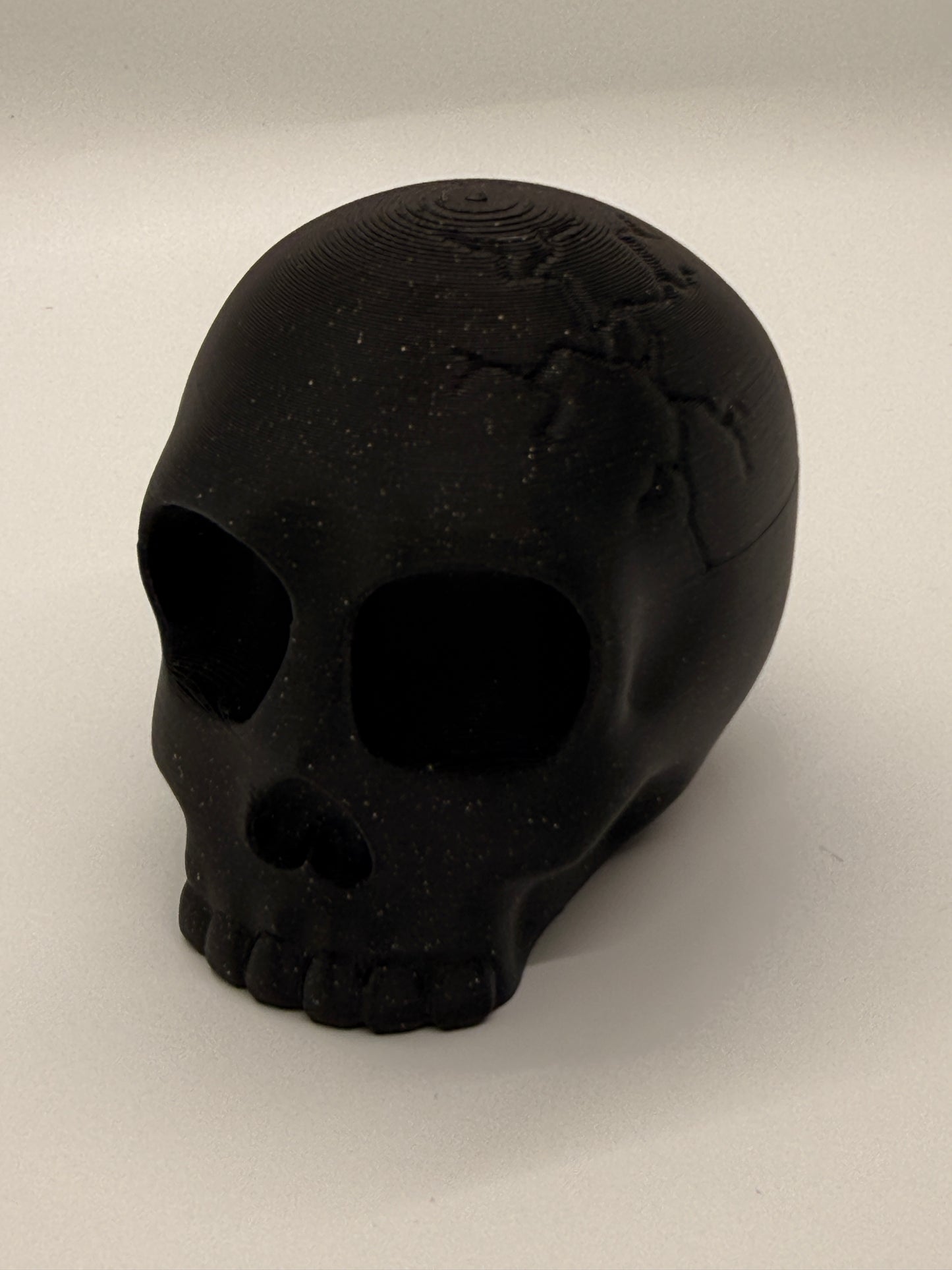 Black skull on a light gray background