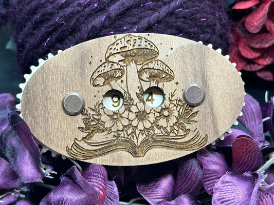 Wooden mushroom-themed counter with floral design on a purple fabric background