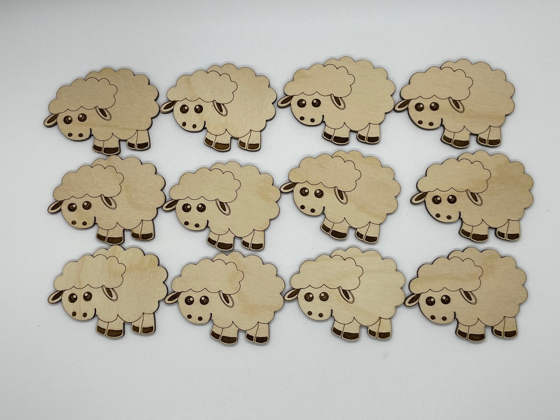 Set of wooden sheep cutouts on a white background