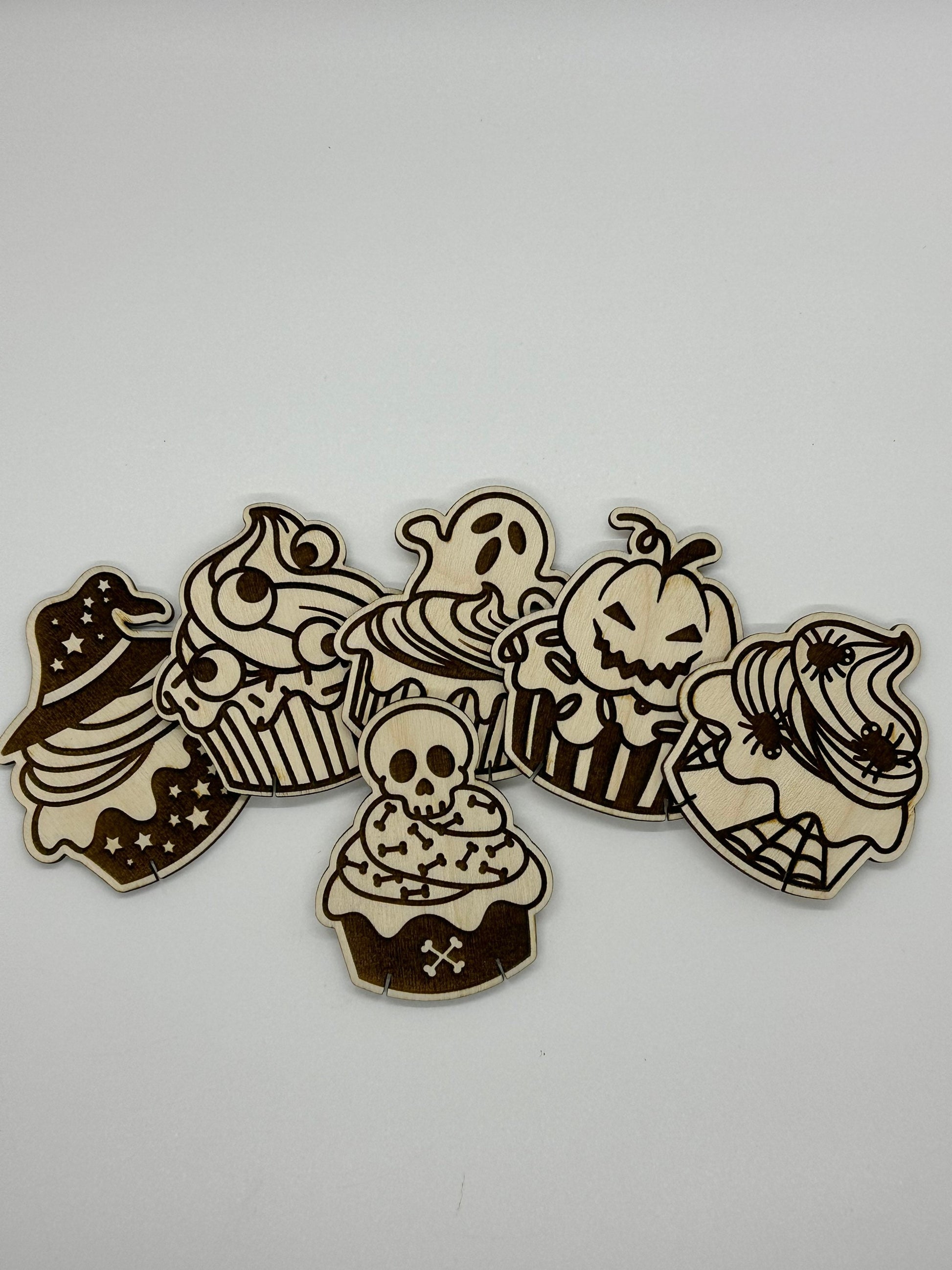 Set of Halloween-themed wooden cutouts on a white background