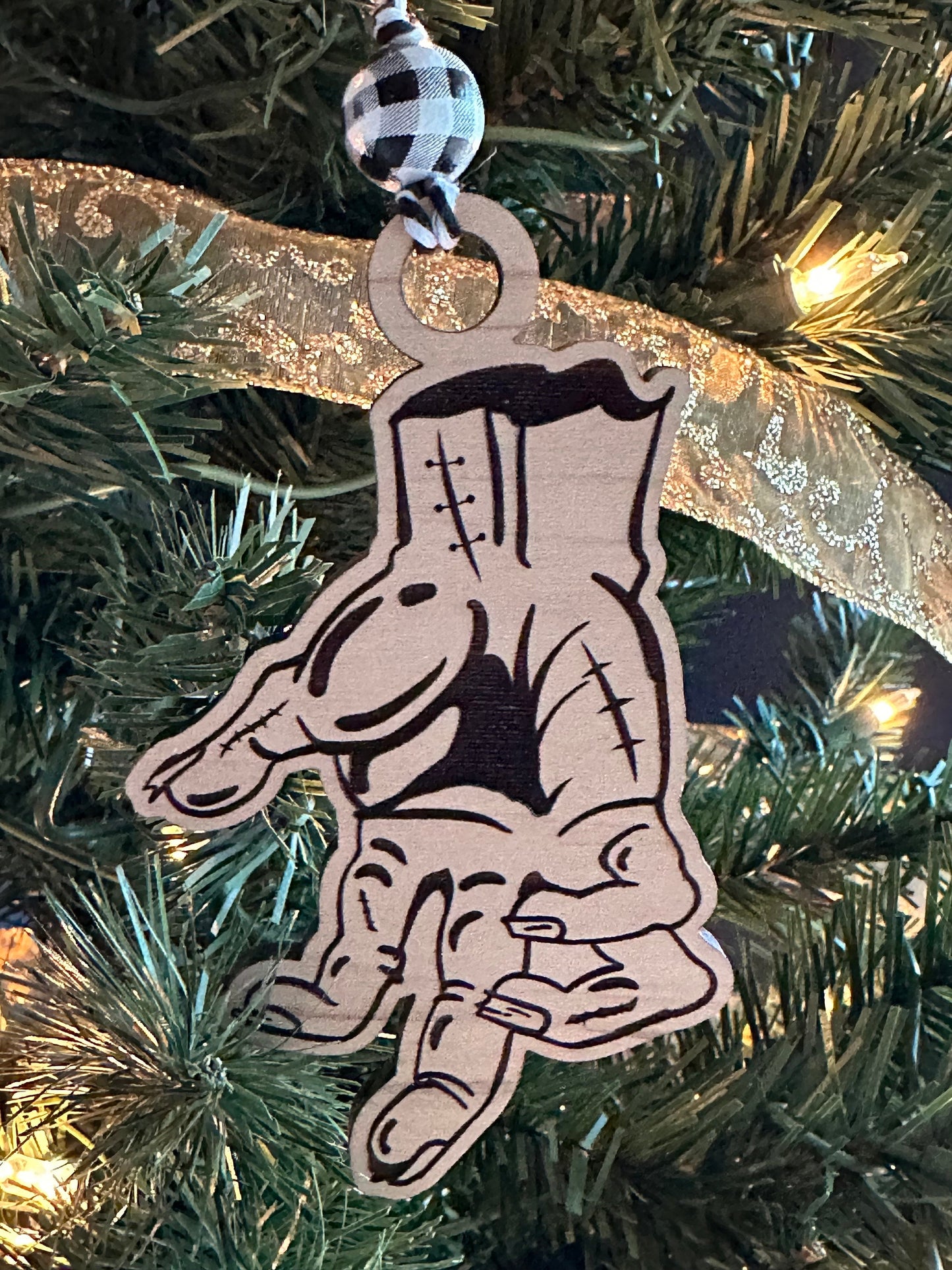 Decorative Christmas ornament shaped like a hand design on a Christmas tree.