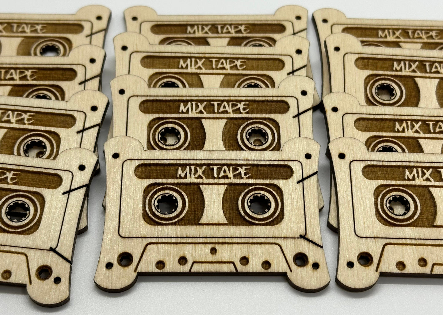 Wooden cutouts of mixtape cassettes on a white background