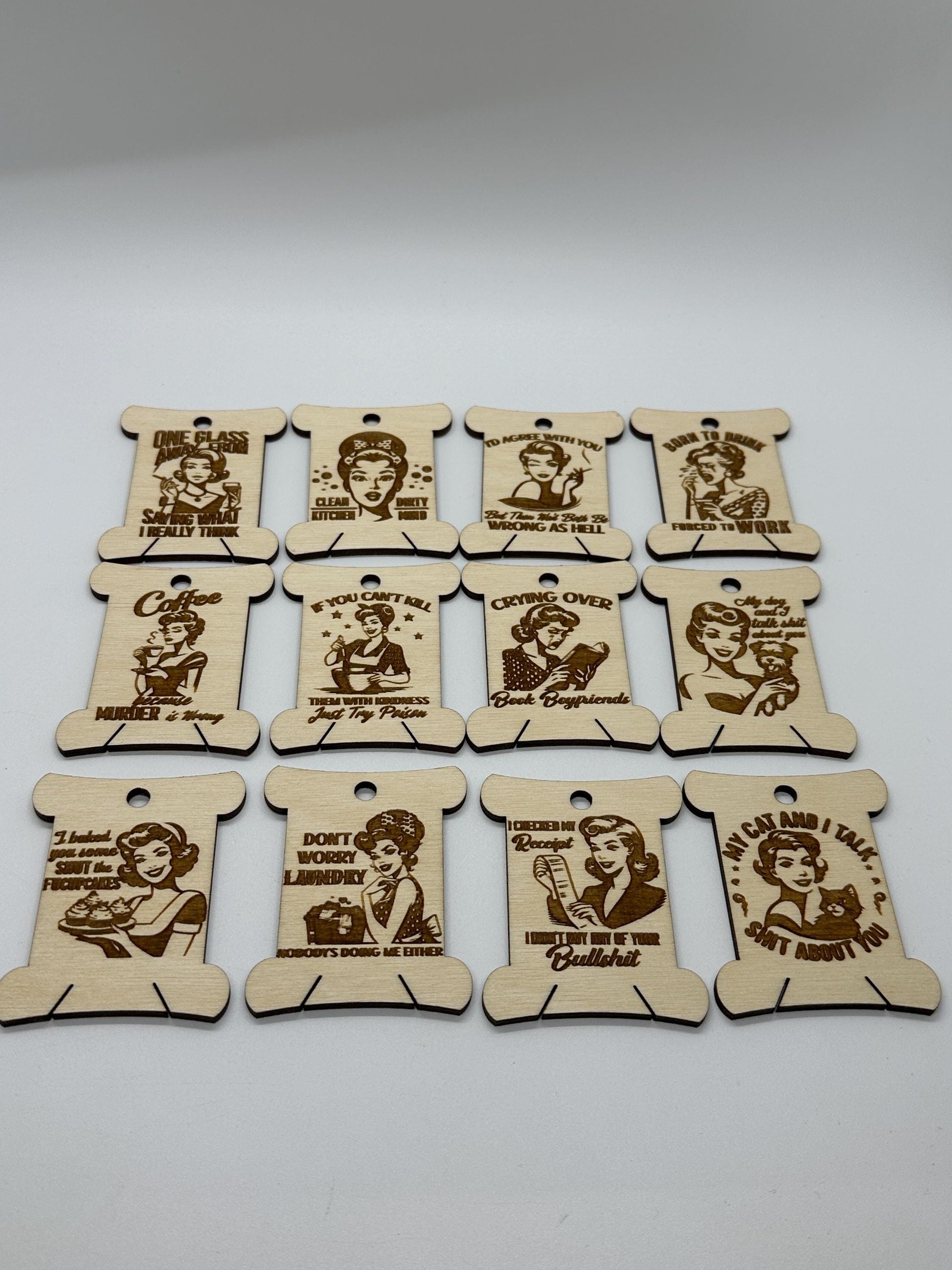 Set of wooden tags with engraved text and illustrations on a white background