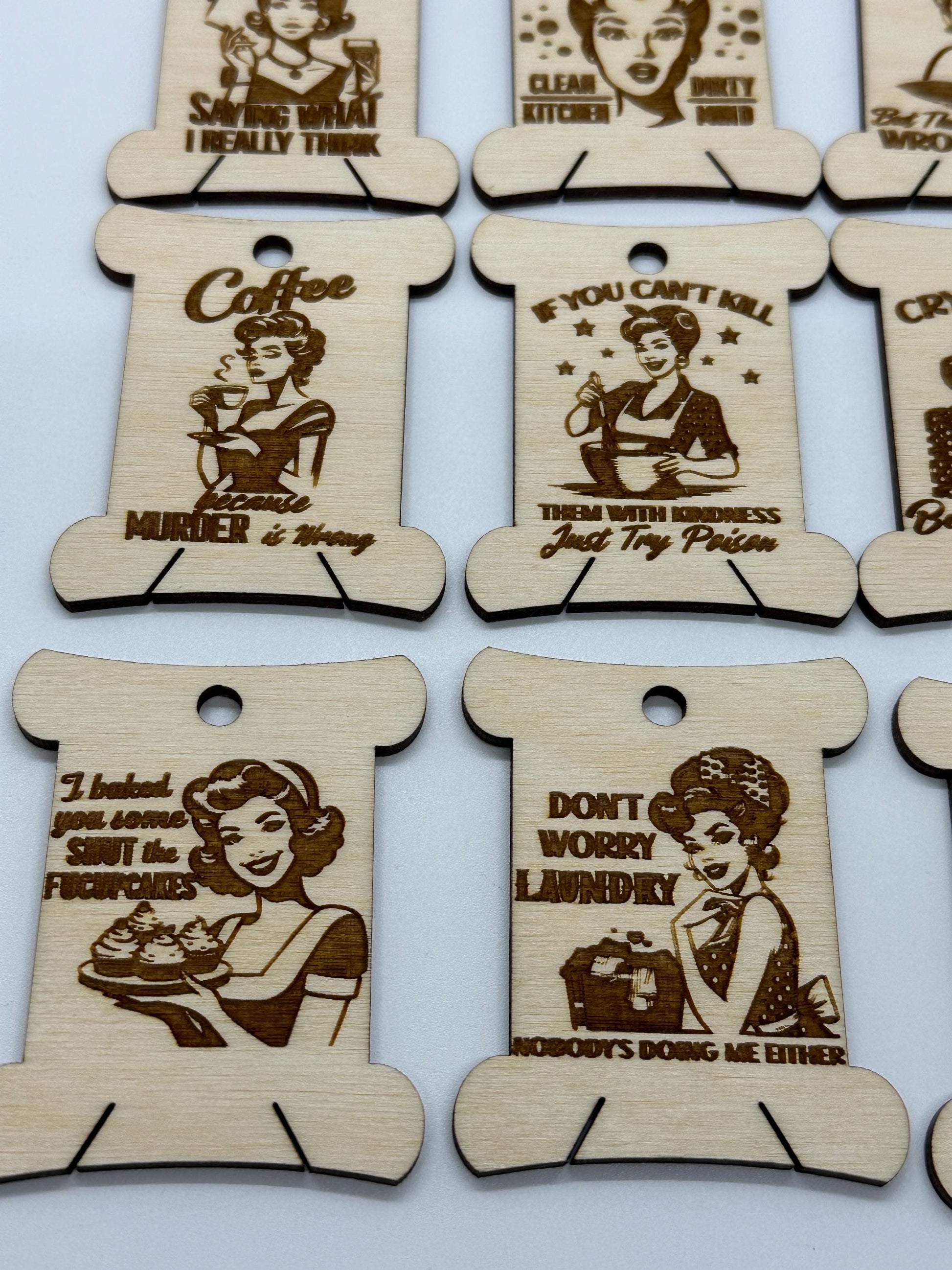 Wooden tags with humorous sayings and illustrations on a white background