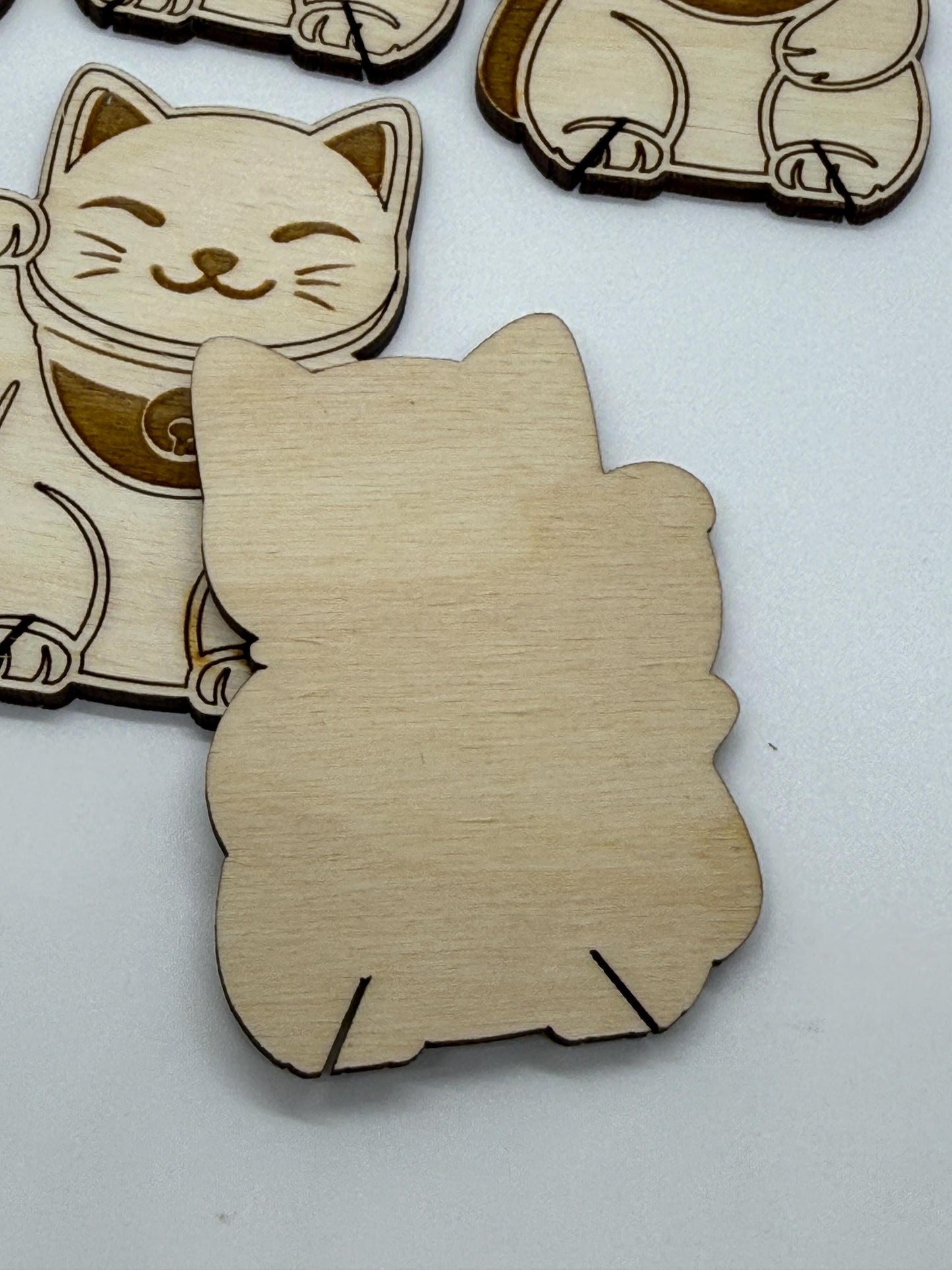 Wooden cat-shaped cutout on a white background