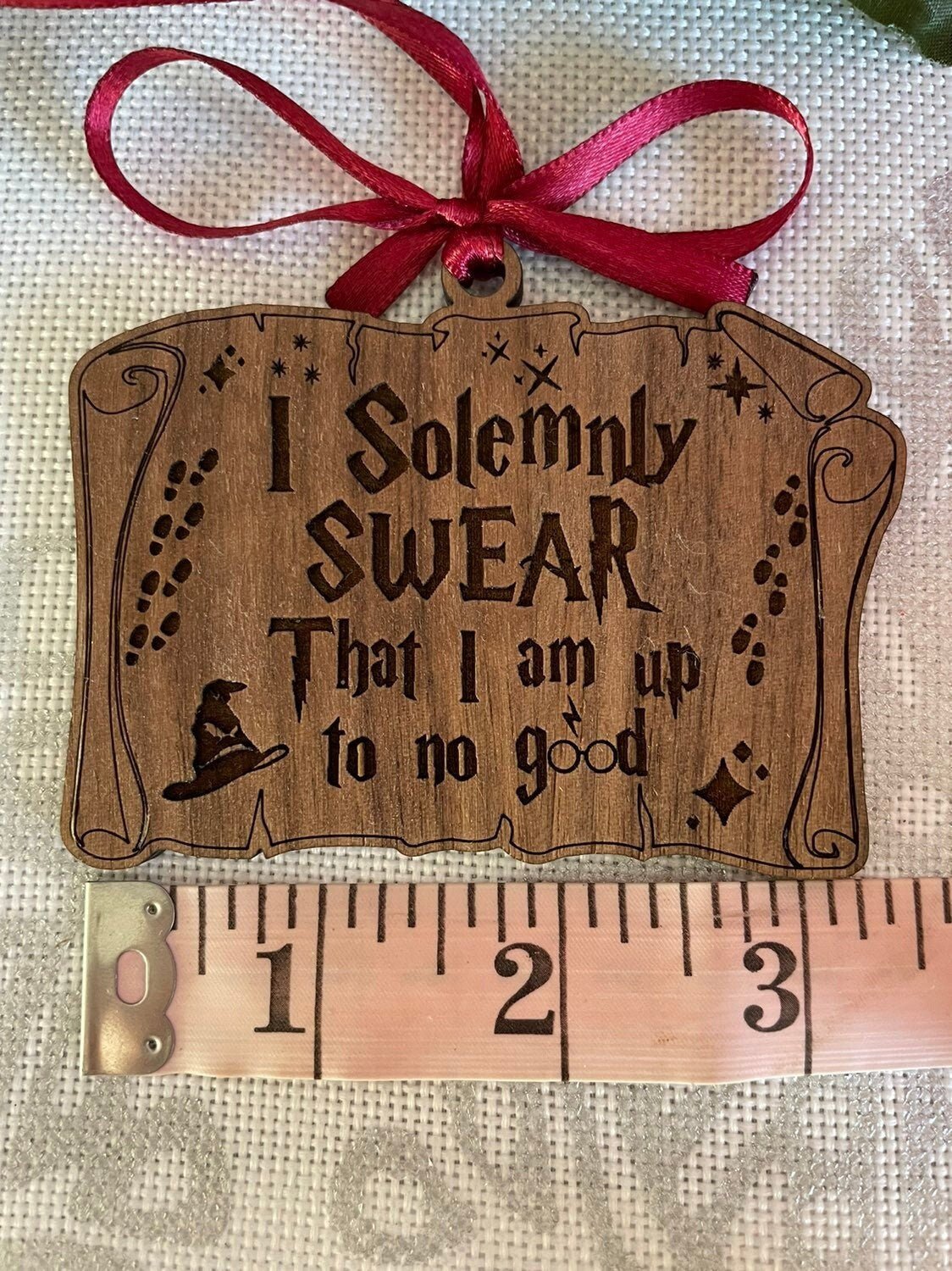 I Solemnly Swear wooden ornament white background showing scale and engraving detail